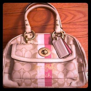 Cream with pink classic coach bag.